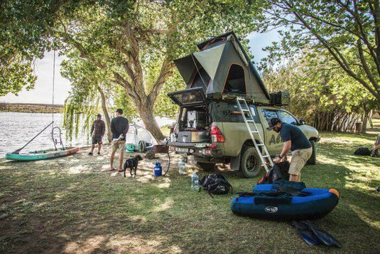 Alu-Cab Rooftop Tent on top of a pickup truck