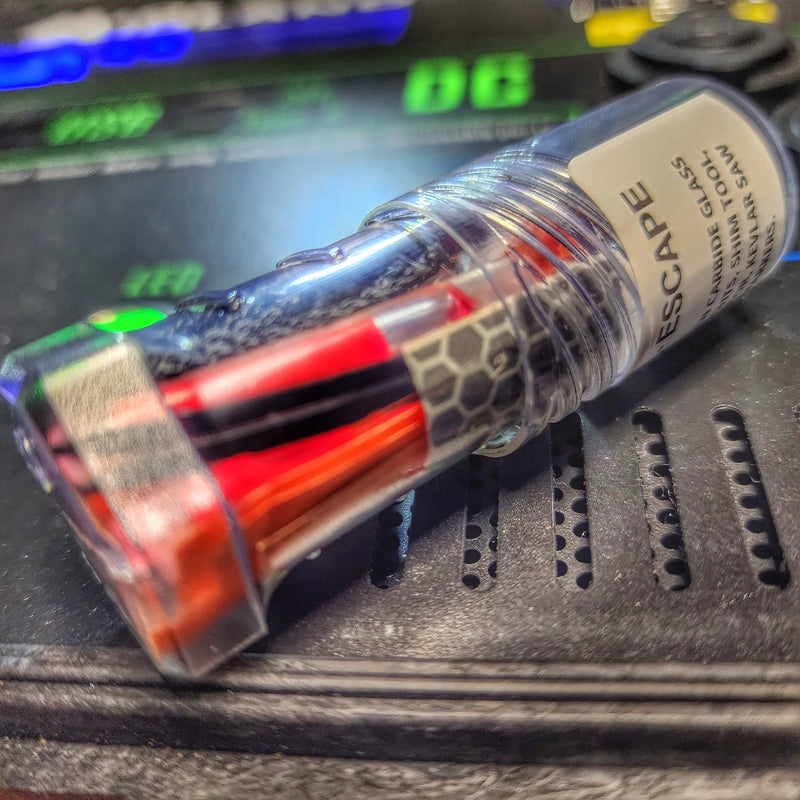 Load image into Gallery viewer, Drop Shell - Polymer Capsule filled with Survival, Escape, and First-Aid Supplies.
